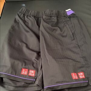 Uniqlo Black Athletic Shorts with Purple Trim and Red Logos